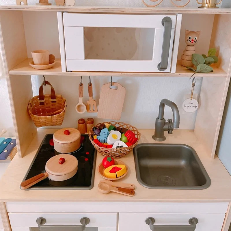 Wooden kitchen toy in tree trunk design